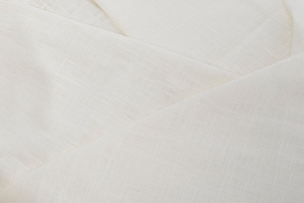 Linnen lijkwade ecru detailfoto van gevouwen stof.